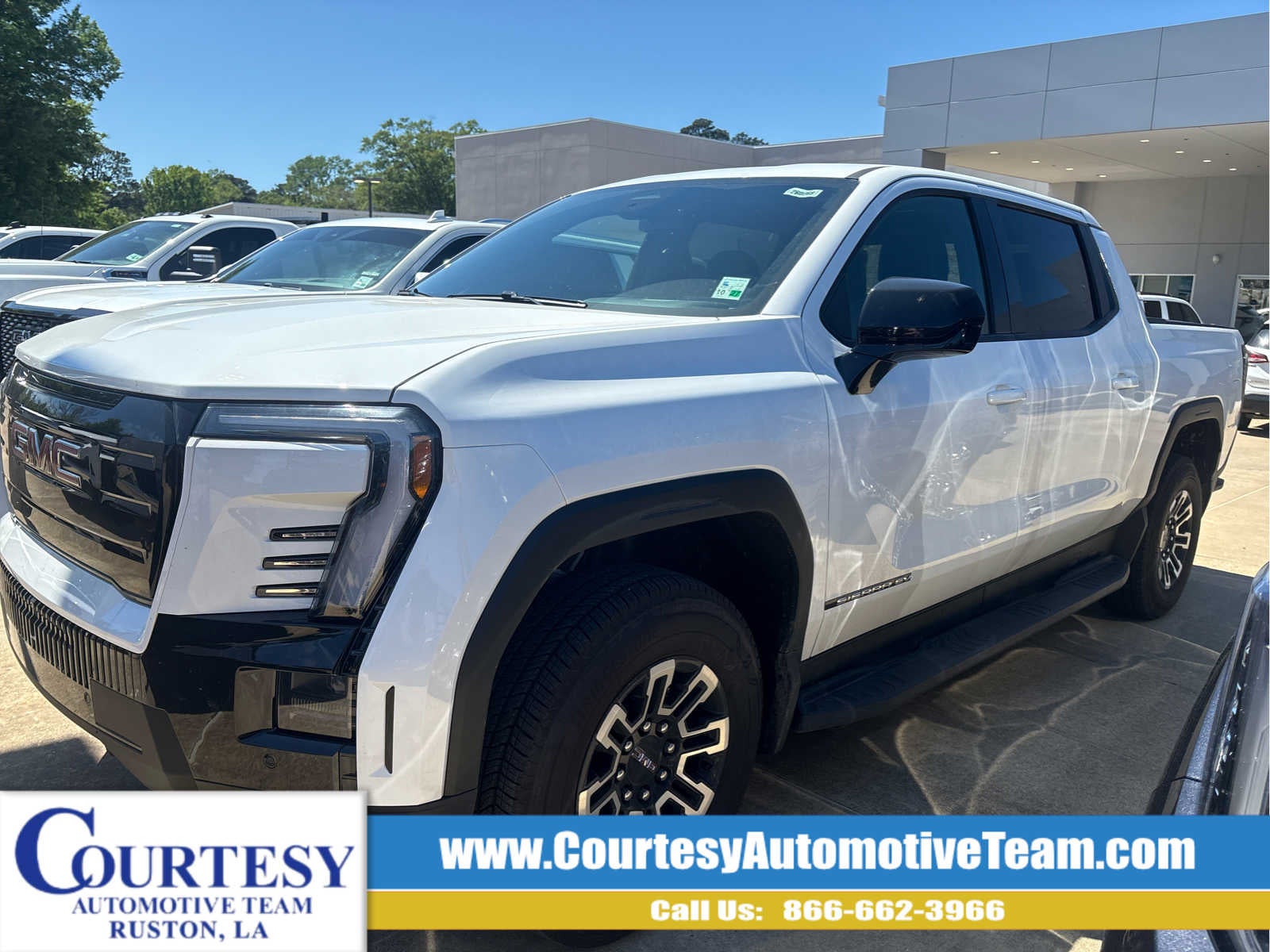 2026 GMC Sierra EV Elevation Standard Range in Summit White — front three-quarter view